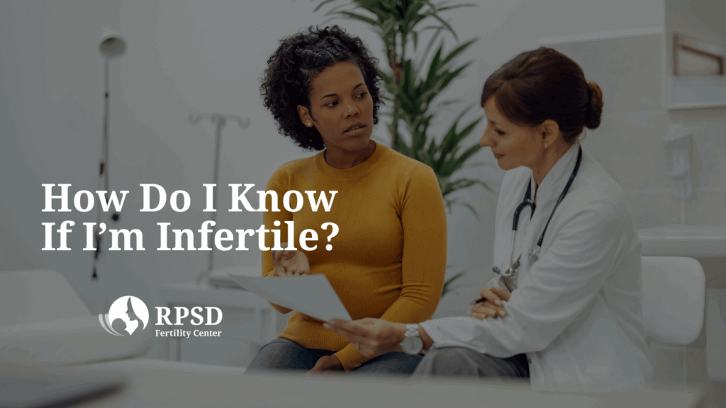 A thoughtful woman sitting on a couch, considering possible signs of infertility and seeking guidance from RPSD fertility specialists in San Diego.